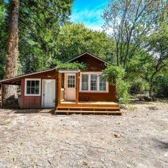 Adorable Cottage Among Trees Close To Everything Thumbnail