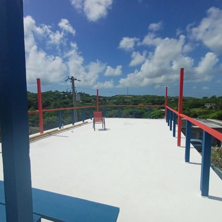 Rooster Run Guest House offers Vieques travelers newly furnished quaint affordable airconditioned rooms and only steps from the Ferry and nearby beaches Thumbnail